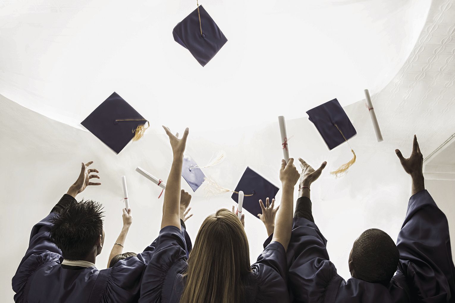 Graduation in the Age of COVID-19 -caps in the air